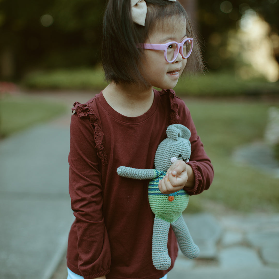 Girl holding Handmade plush toy Rabbit