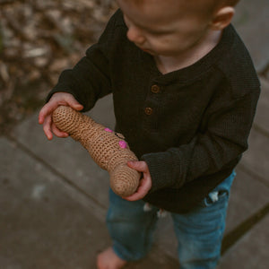 toddler with fair trade cotton croissant toy food rattle