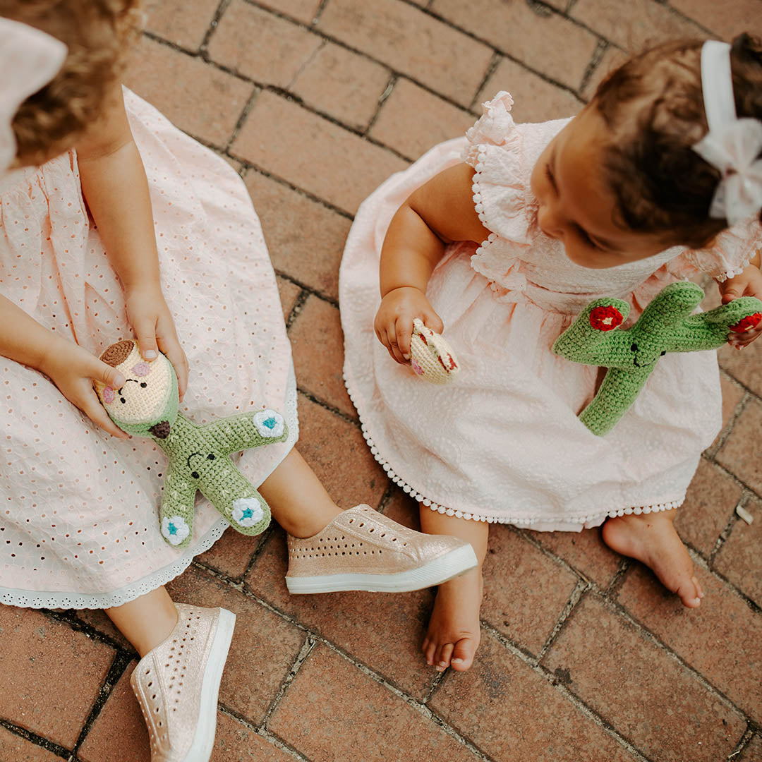 Girls playing with Avocado and Cactus Stuffed Toys