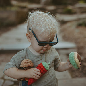 Boy holding Crochet Handmade Avocado and Red Chili Baby Toys