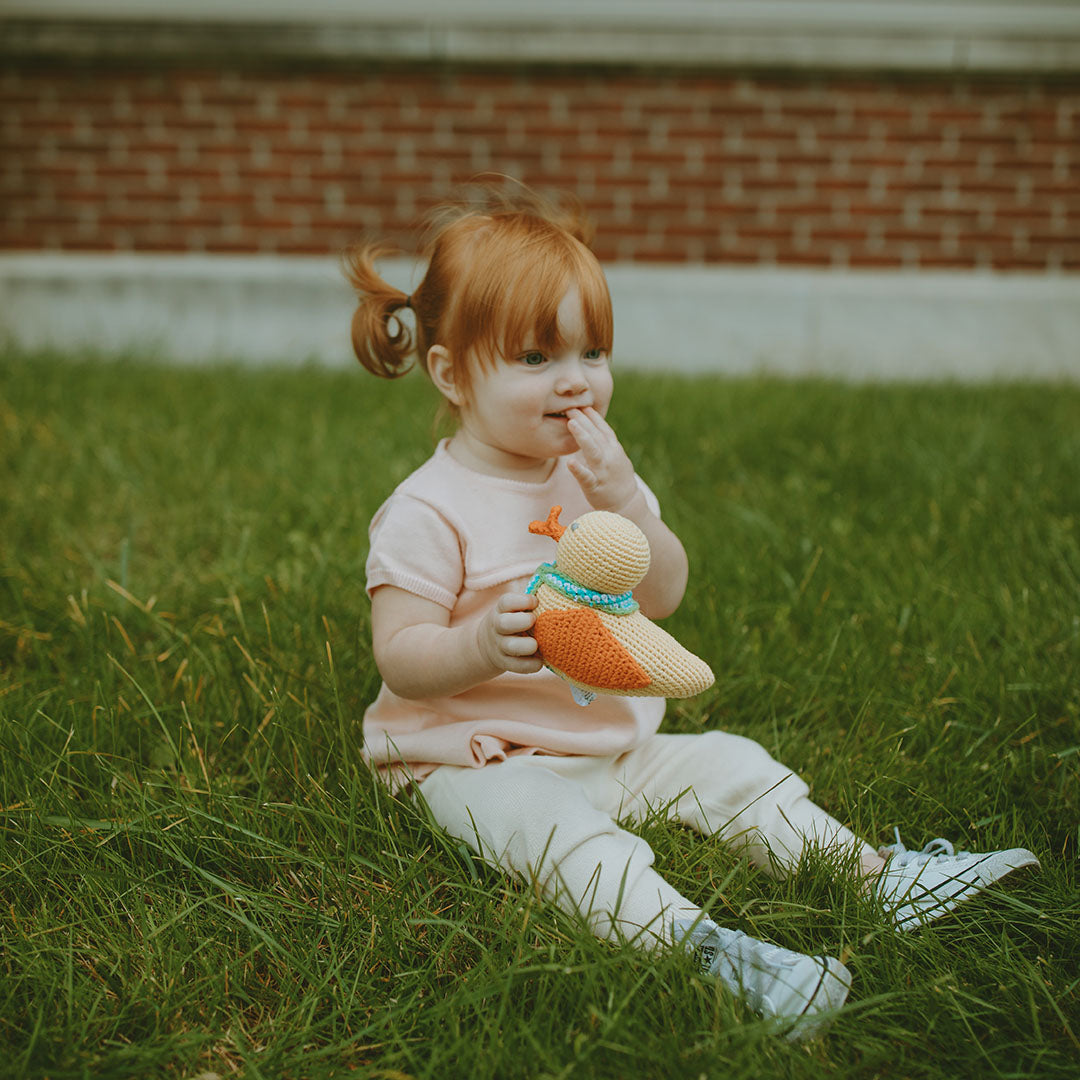 GIrl holding Easter Baby Duck Plush Toy