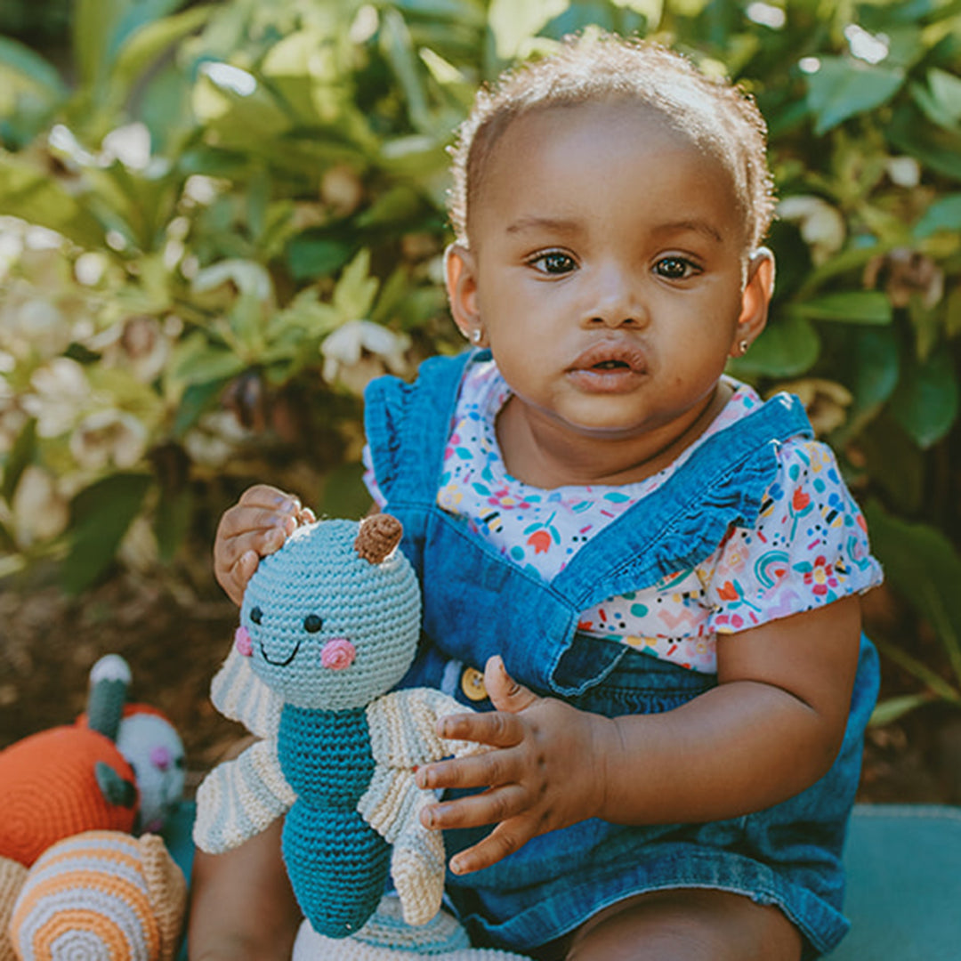 Baby holding Organic Cotton Crochet Blue Dragonfly Plush Rattle