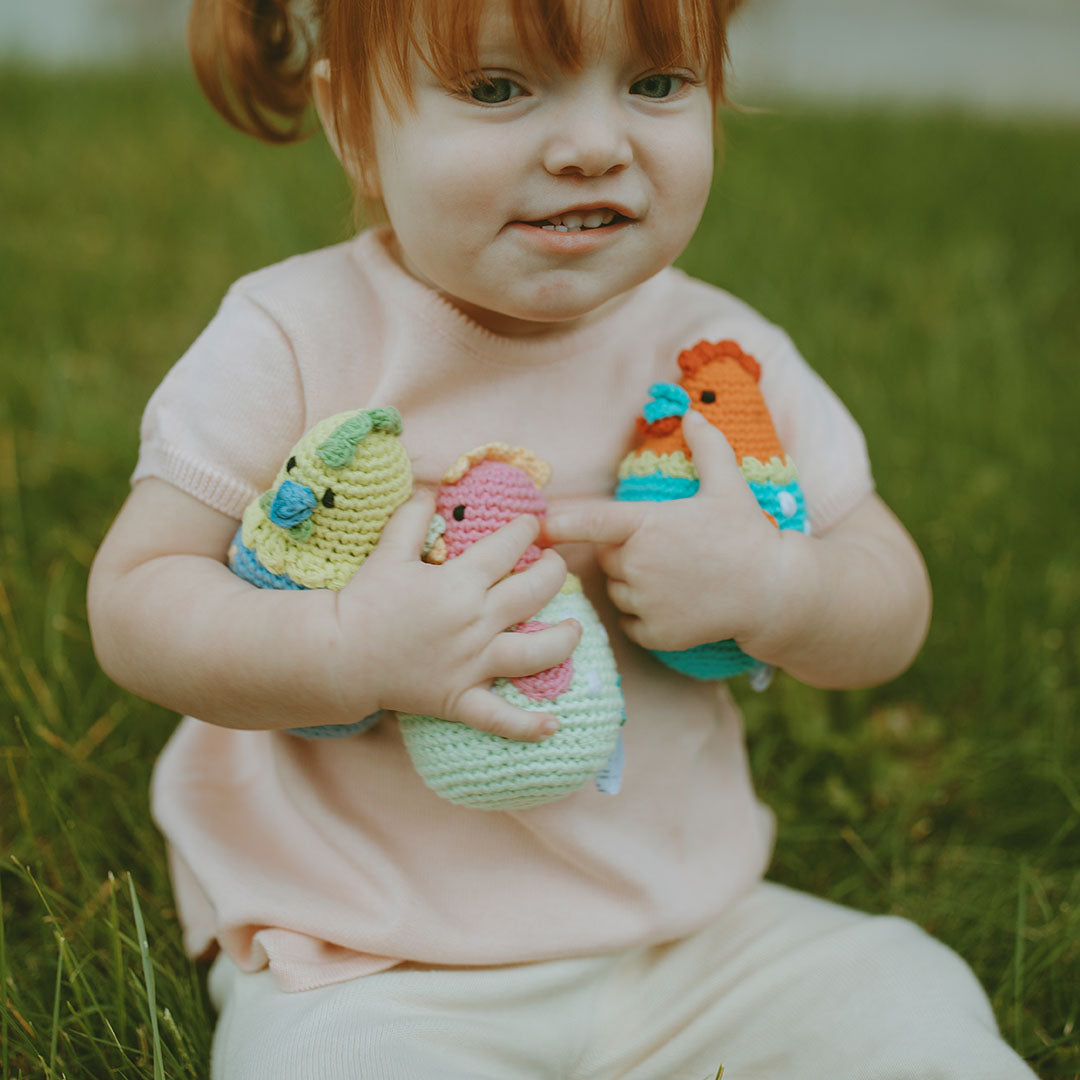 Toddler holding Crochet Cotton Plush Chicks.