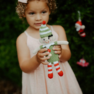 Girl holding small handmade Elf Baby Toy Rattle