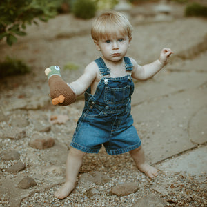 Boy holding Fair Trade Mallard Duck Baby Toy Rattle