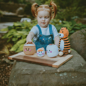 Girl with plush tiger and handmade sushi soft toys